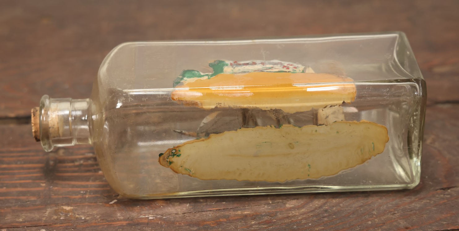 Lot 006 - Vintage Folk Art Ship In A Bottle, Handcrafted With Backdrop, Ship Has American Flag, Circa 1930