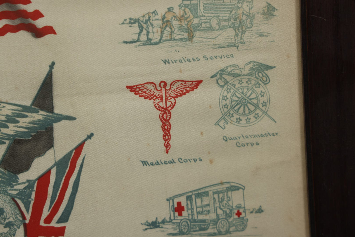 Lot 035 - Antique World War One Printed Commemorative Textile In Frame, Featuring Different Elements Of The War And Military Including Tanks, Signal Corps, Aviation, Etc., 18.5" X 19.5", Note Water Stains