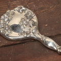 Lot 039 - Antique Silverplate Art Nouveau Repousse Beveled Glass Dresser Brush With Woman's Face, Cherubs In Flowers, Marked Hope Silver Co., Anchor Hallmark