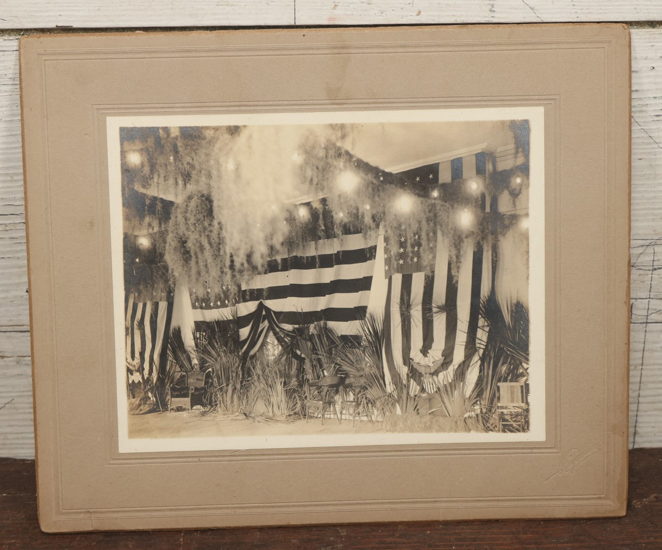 Lot 062 - Antique Boarded Photograph Of American Flags, Bunting, Palms, Unknown Location