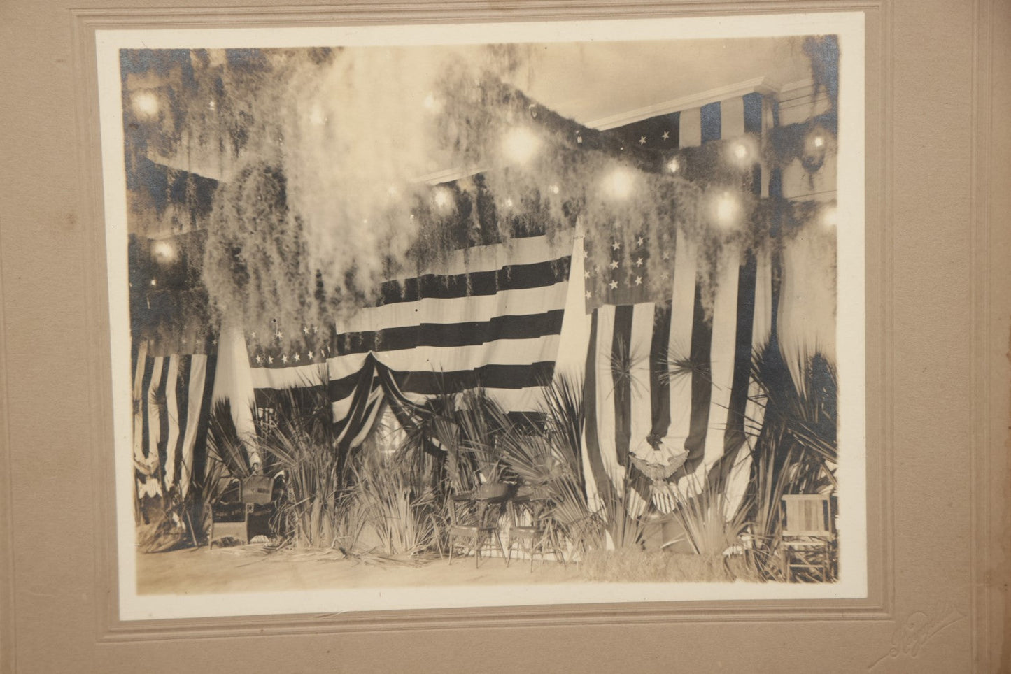 Lot 062 - Antique Boarded Photograph Of American Flags, Bunting, Palms, Unknown Location