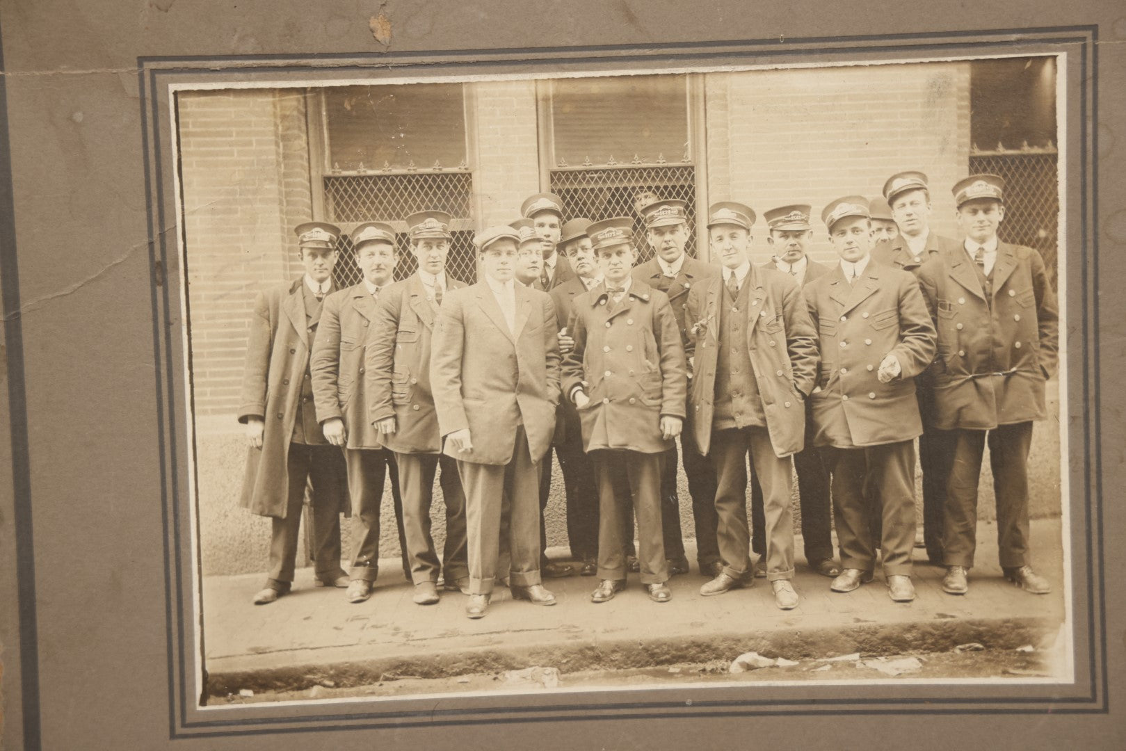 Lot 064 - Antique Boarded Occupational Group Photograph, Men In Uniform, Train Conductors, Note Losses To Board