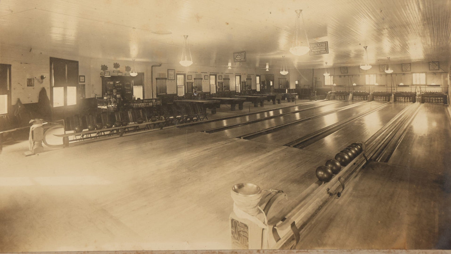 Lot 068 - Antique Boarded Occupational Photograph Of An Old Time Bowling Alley, With Man Behind Counter, Signage