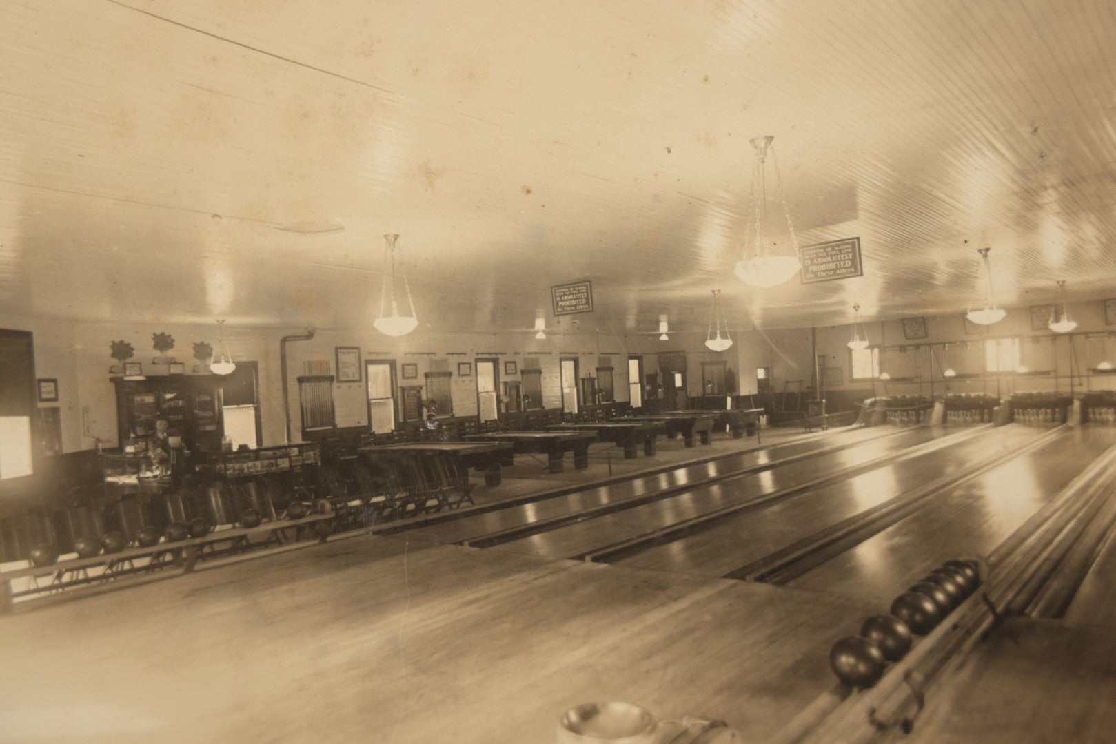 Lot 068 - Antique Boarded Occupational Photograph Of An Old Time Bowling Alley, With Man Behind Counter, Signage