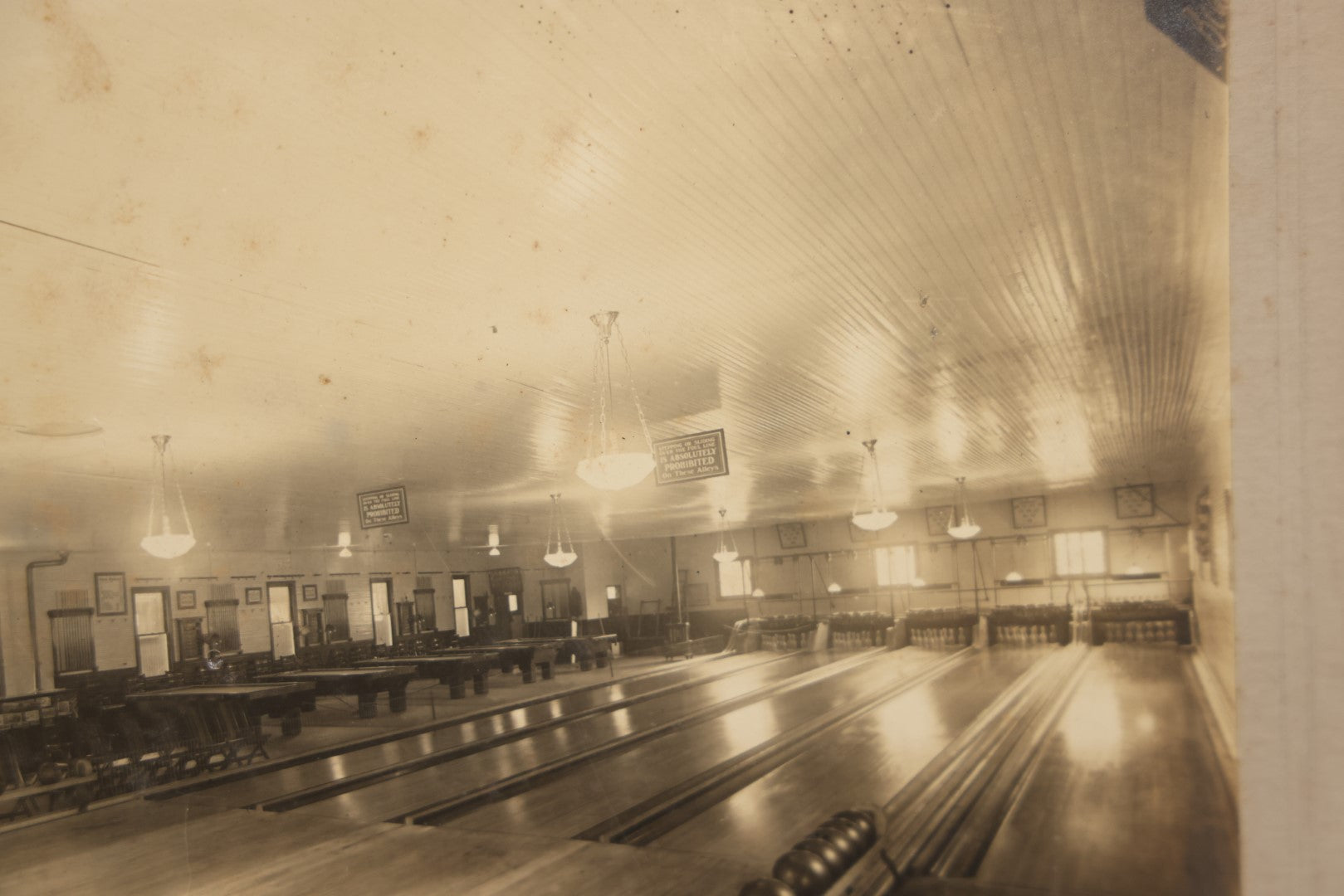 Lot 068 - Antique Boarded Occupational Photograph Of An Old Time Bowling Alley, With Man Behind Counter, Signage