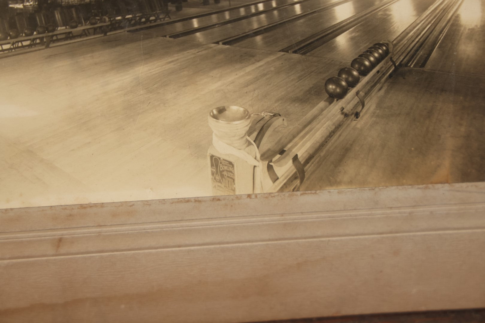 Lot 068 - Antique Boarded Occupational Photograph Of An Old Time Bowling Alley, With Man Behind Counter, Signage