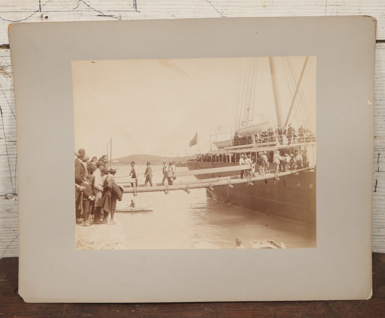 Lot 070 - Antique Boarded Photograph Of A Ship At Port, Bermuda, With Passengers And Workers Visible