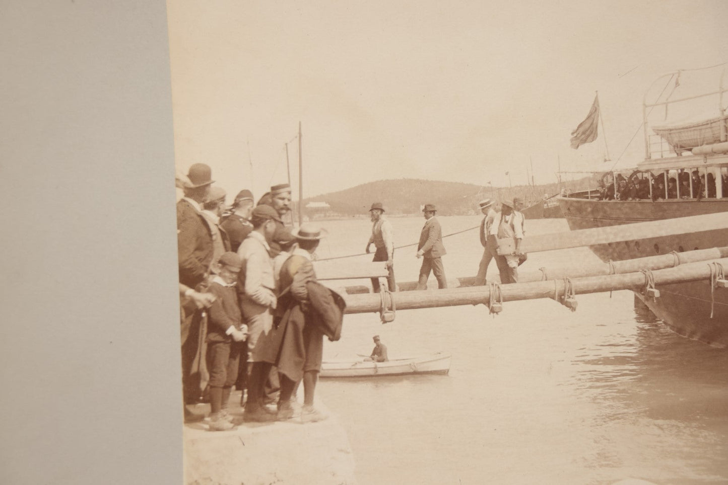 Lot 070 - Antique Boarded Photograph Of A Ship At Port, Bermuda, With Passengers And Workers Visible