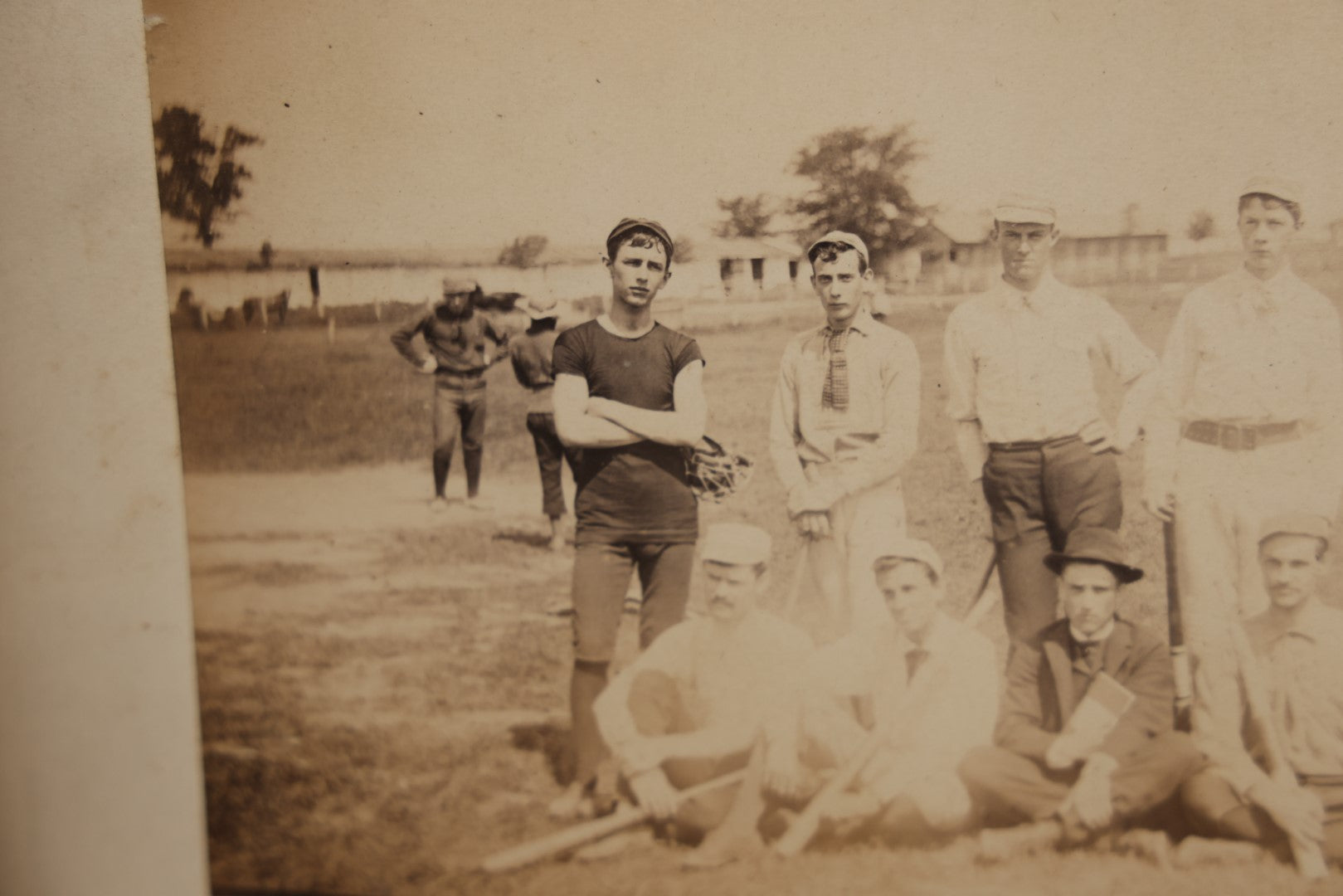 Lot 007 - Pair Of Early Antique Baseball Team Group Mounted Photographs, From A Photo Album, Note Pitcher In Background, Early Uniforms And Gear, Circa Late 1880s, Other Photos On Back, Approx 7-1/2" x 4-1/2" Actual Photo Dimensions