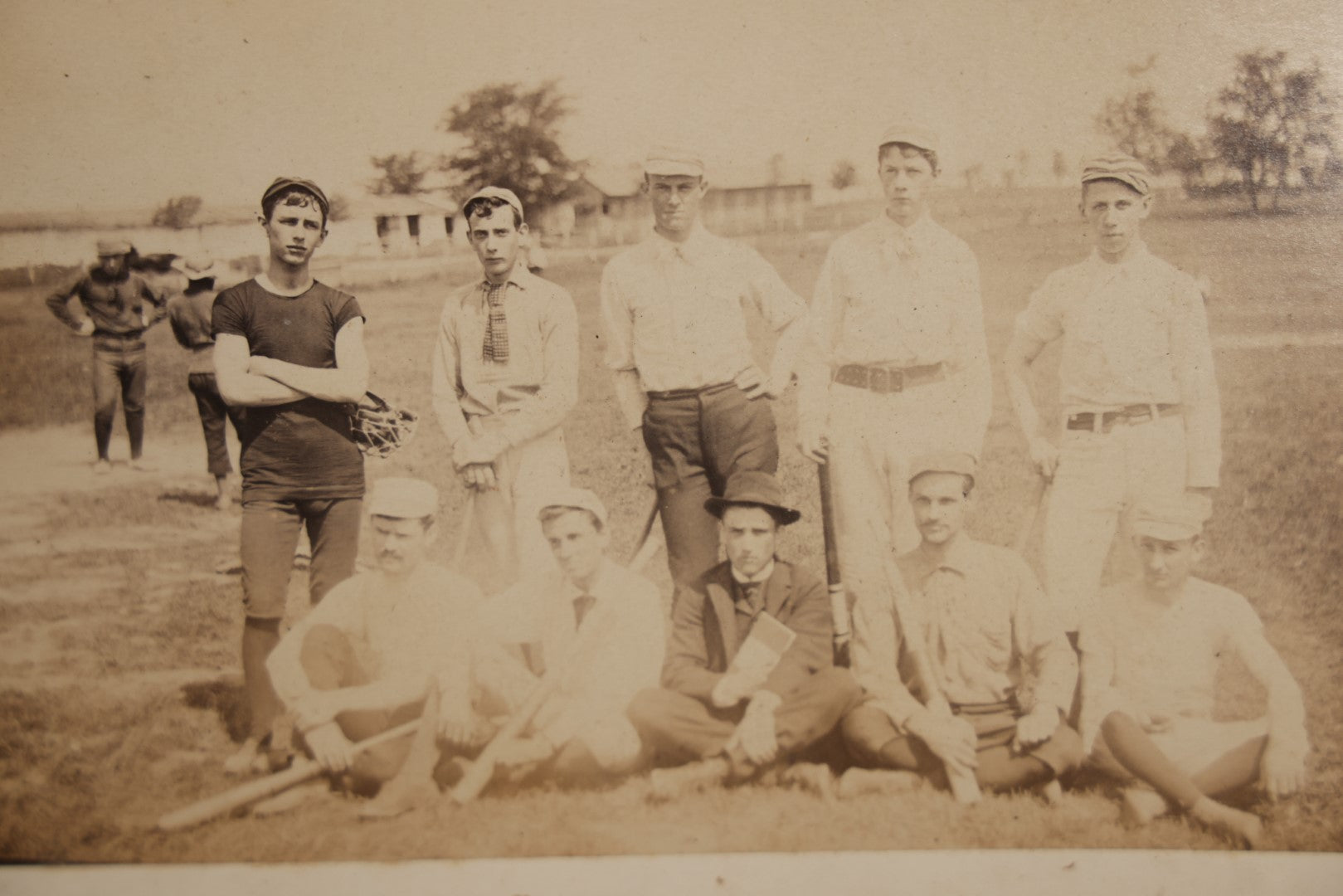 Lot 007 - Pair Of Early Antique Baseball Team Group Mounted Photographs, From A Photo Album, Note Pitcher In Background, Early Uniforms And Gear, Circa Late 1880s, Other Photos On Back, Approx 7-1/2" x 4-1/2" Actual Photo Dimensions