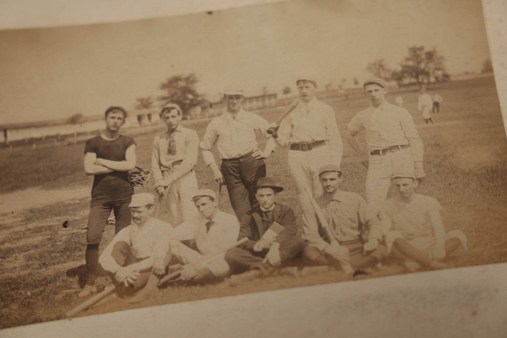 Lot 007 - Pair Of Early Antique Baseball Team Group Mounted Photographs, From A Photo Album, Note Pitcher In Background, Early Uniforms And Gear, Circa Late 1880s, Other Photos On Back, Approx 7-1/2" x 4-1/2" Actual Photo Dimensions