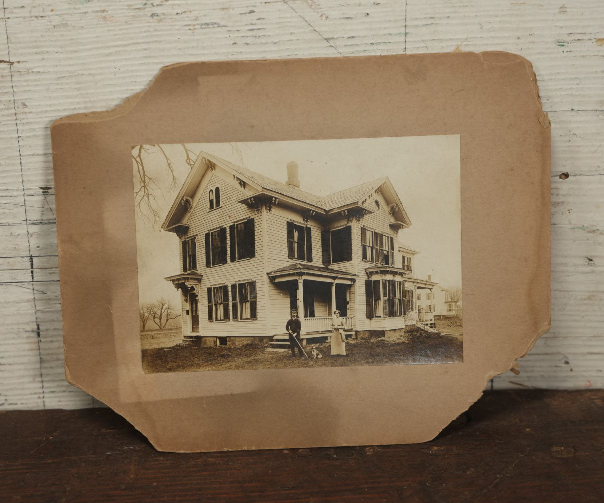 Lot 134 - Antique Boarded Photo Of A Man, Woman, And Their Little Dog Outside Their House, Note Losses To Board