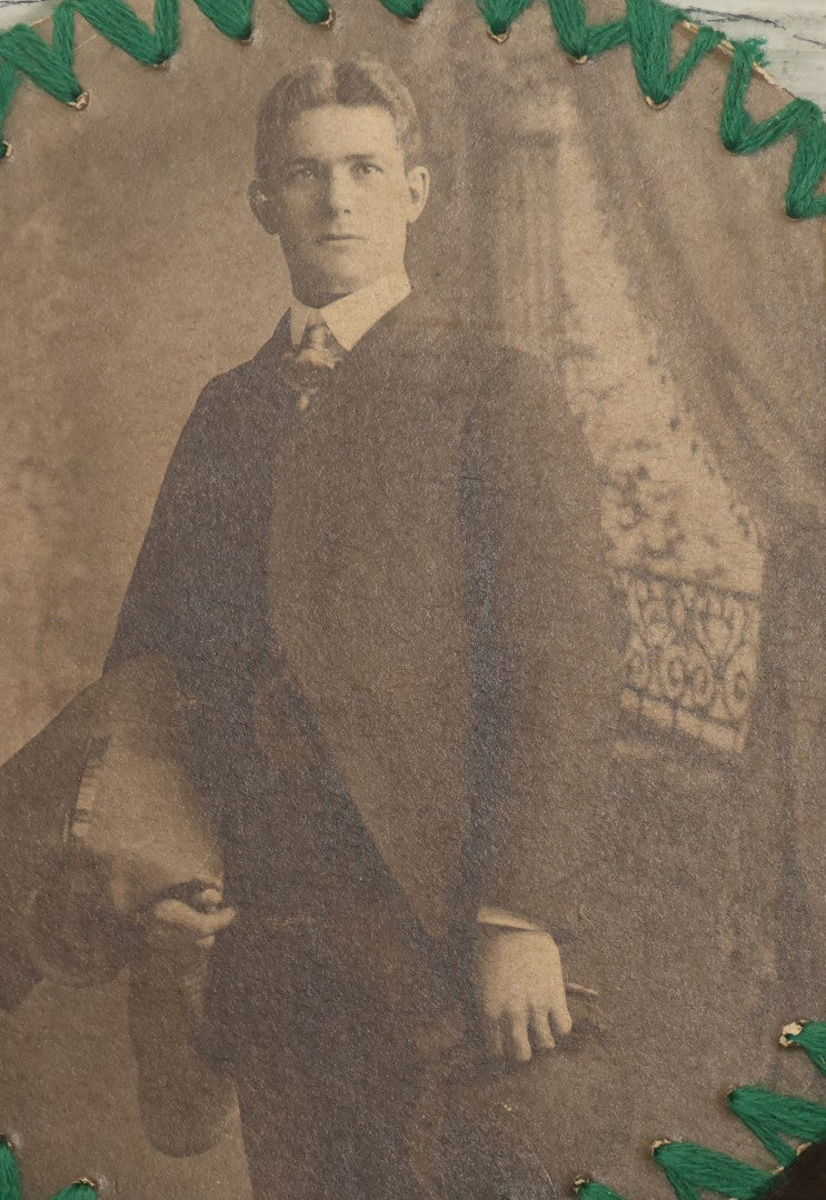 Lot 136 - Antique Circle Boarded Photo Of A Handsome Young Man With Folk Art String Design Around The Outside Edge With Green Thread