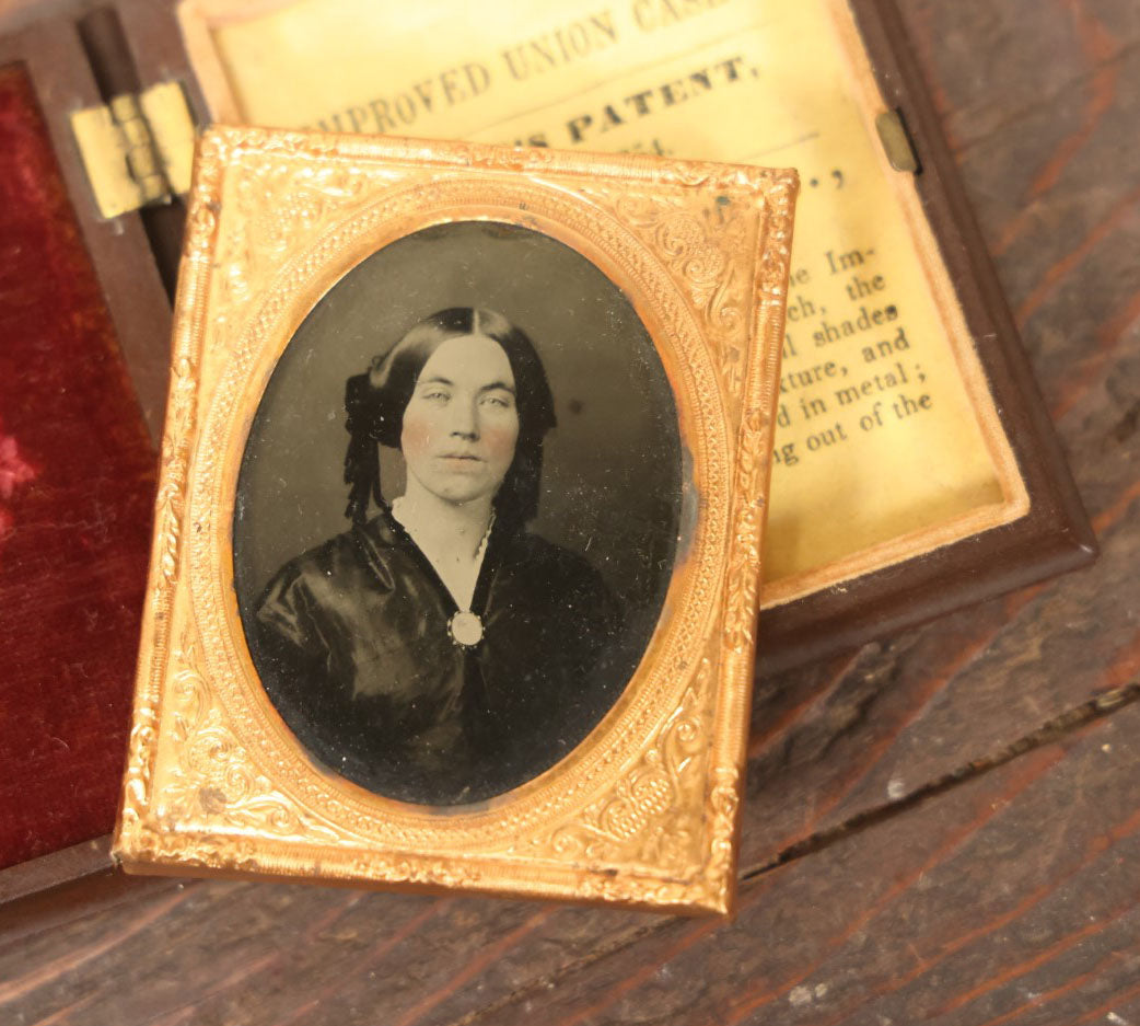 Lot 023 - Antique 1/9th Plate Ambrotype Photograph Of A Pretty Young Woman With Tinted Cheeks, In Brown Thermoplastic Case By S. Peck & Co., New Haven, Connecticut, Photo By Davis Brothers, Portsmouth, New Hampshire, Circa 1859