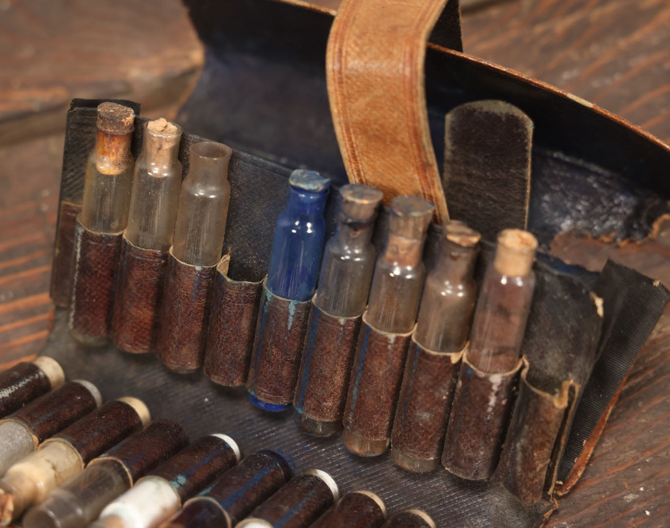 Lot 024 - Antique Leather Traveling Apothecary Wallet Kit With Many Glass Vials With Contents, Wear And Losses To Leather