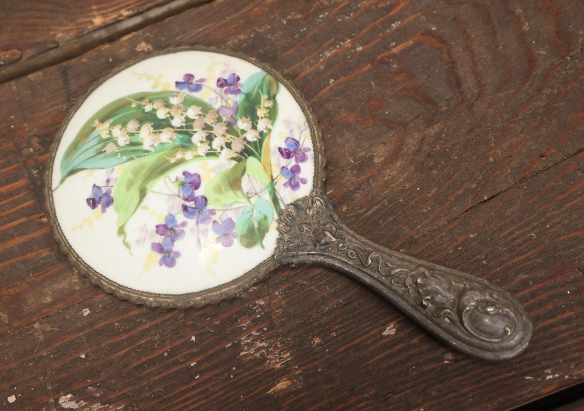 Lot 028 - Antique Silverplate Handle Hand Held Dresser Mirror With Hand Painted Porcelain Backing, Note Mirror Worn, Not Usable, Needs Replaced