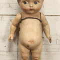 Lot 038 - Antique Composition Kewpie Like Doll With Cute Face, Painted Details, 14" Tall, Various Wear And Loss To Porcelain