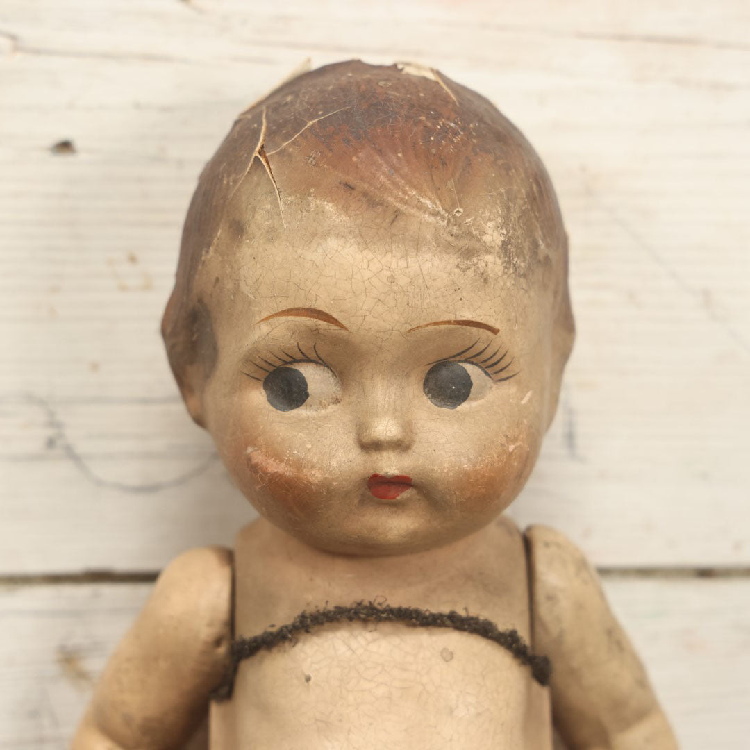 Lot 038 - Antique Composition Kewpie Like Doll With Cute Face, Painted Details, 14" Tall, Various Wear And Loss To Porcelain