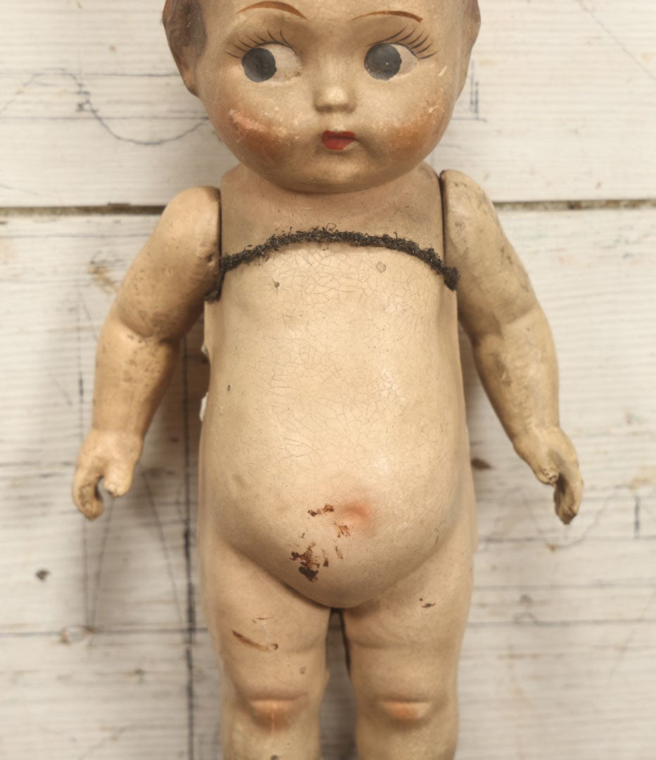 Lot 038 - Antique Composition Kewpie Like Doll With Cute Face, Painted Details, 14" Tall, Various Wear And Loss To Porcelain