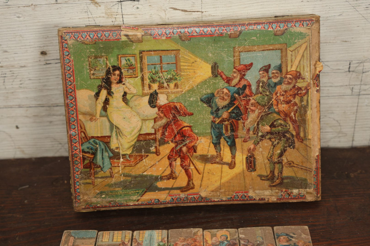 Lot 041 - Antique Lithographed Block Puzzle With Snow White And The Seven Dwarves On Cover, 35 Pieces, Complete, Various Wear And Losses, Fading