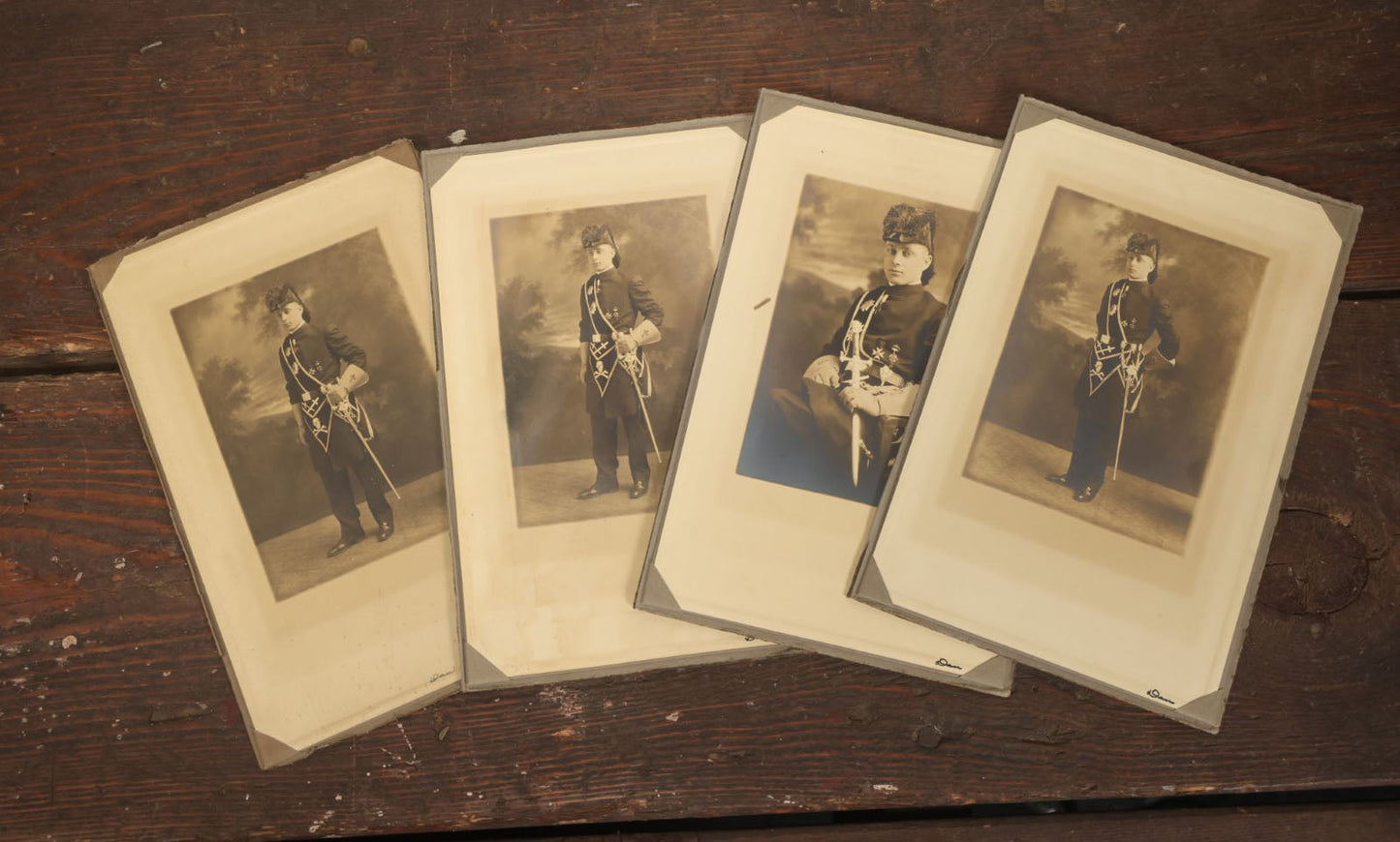 Lot 042 - Grouping Of Four Antique Foldered Portrait Photos Of A Young Knights Templar / Freemasons Member, "Dan," In Uniform With Skull And Crossbones Apron, From Gardner Artist Studio, Gardner, Massachusetts