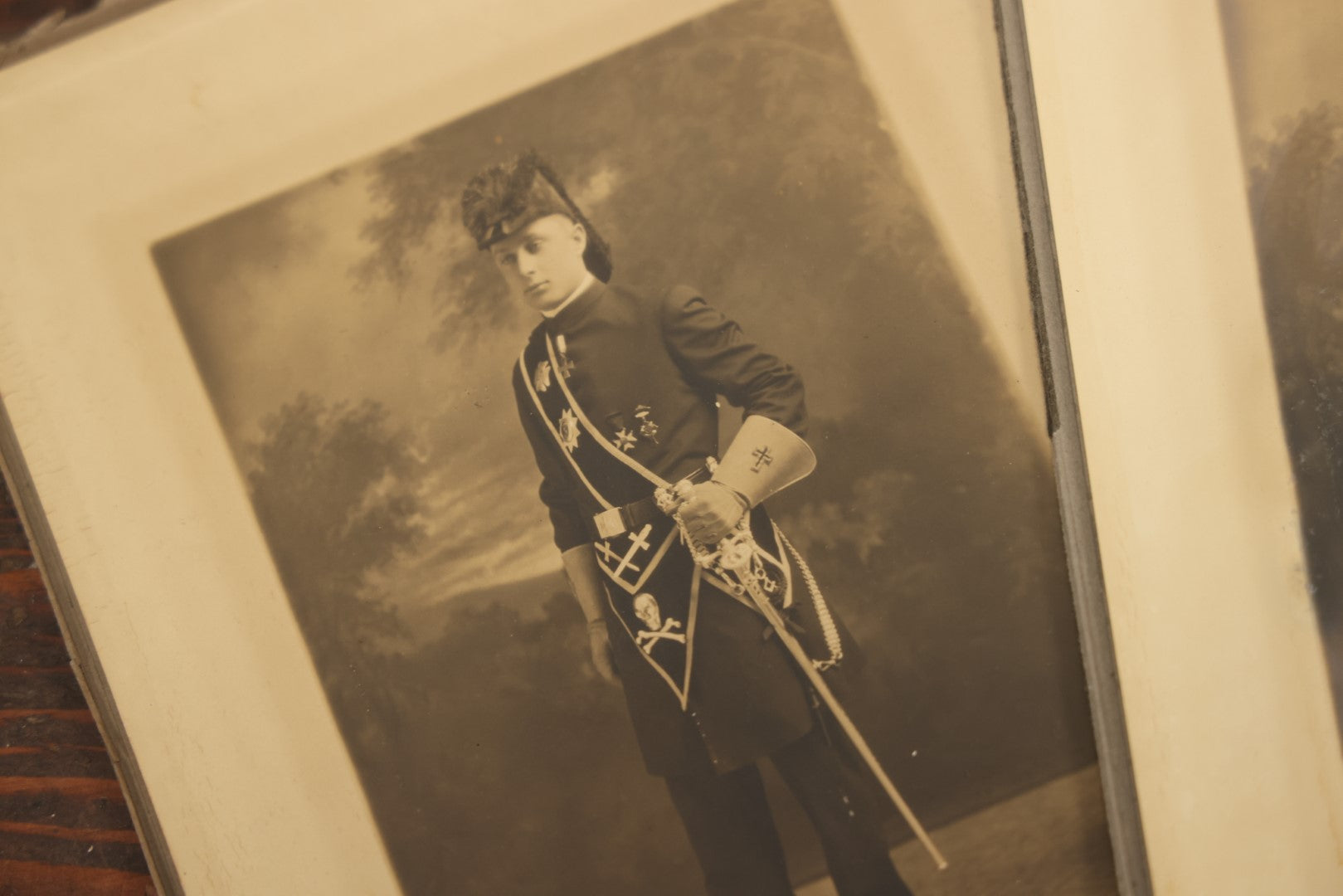 Lot 042 - Grouping Of Four Antique Foldered Portrait Photos Of A Young Knights Templar / Freemasons Member, "Dan," In Uniform With Skull And Crossbones Apron, From Gardner Artist Studio, Gardner, Massachusetts