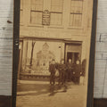 Lot 051 - Antique Cabinet Card Occupational Photograph Of Four Men Outside Of A Commercial Building Store Front, Sign Says "Cook's", Real Estate Sign, Building In Window Reflection, Men Id'd On Back
