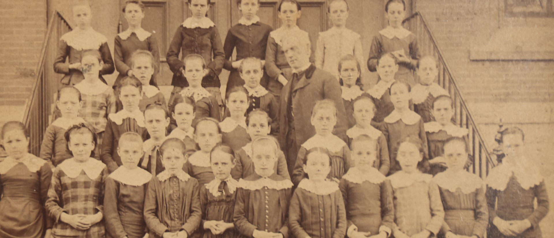 Lot 053 - Antique Cabinet Card Photograph Of An All Girls School Class, Outside Building, With Adult Man Teacher Or Headmaster, Writing On Back, Essex Street, Salem