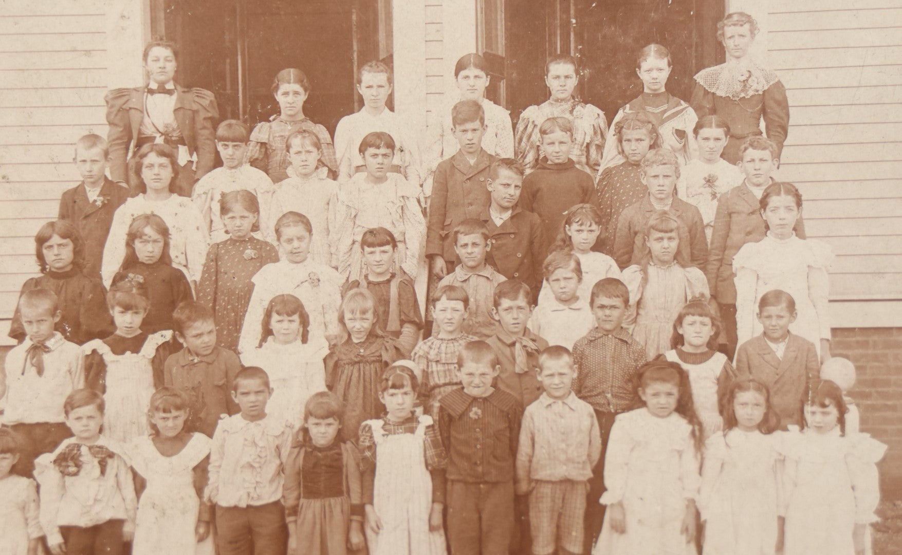 Lot 054 - Antique Cabinet Card Photograph Of A School Class Of Young Children, Boys And Girls, With Two Women Teachers, Standing On Steps, Note Many Barefoot Children, By A.W. & G.E. Howes, Photographers, Ashfield, Massachusetts]