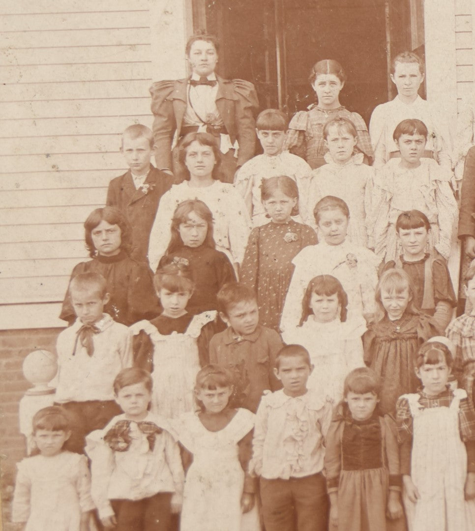 Lot 054 - Antique Cabinet Card Photograph Of A School Class Of Young Children, Boys And Girls, With Two Women Teachers, Standing On Steps, Note Many Barefoot Children, By A.W. & G.E. Howes, Photographers, Ashfield, Massachusetts]