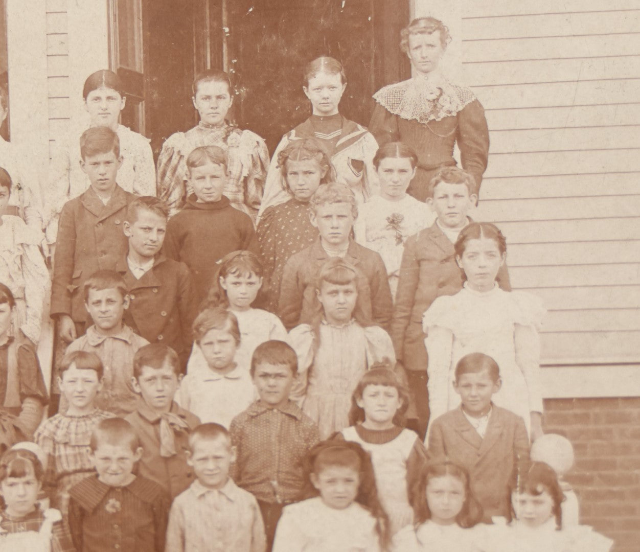 Lot 054 - Antique Cabinet Card Photograph Of A School Class Of Young Children, Boys And Girls, With Two Women Teachers, Standing On Steps, Note Many Barefoot Children, By A.W. & G.E. Howes, Photographers, Ashfield, Massachusetts]