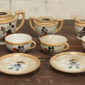 Lot 056 - Grouping Of Eight Vintage Hand Painted Mickey And Minnie Mouse Disney Tea Set Pieces Including Teapot, Creamer, Sugar Bowl, Cups, And Plates, Note Various Chips, Wear, Made In Occupied Japan, Walt Disney Productions