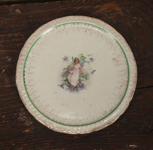 Lot 059 - Antique Porcelain Transferware Fairy Trivet, Fairy In Pink Dress With Flowers, S.P. Co. Porcelain, Circa 1860s, Per Note On Back