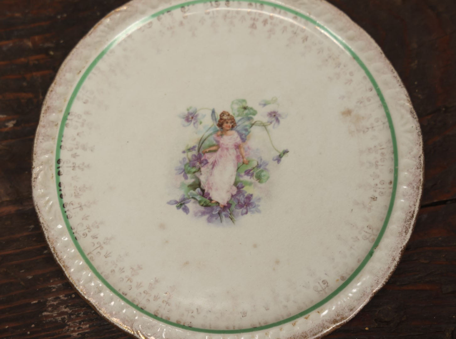 Lot 059 - Antique Porcelain Transferware Fairy Trivet, Fairy In Pink Dress With Flowers, S.P. Co. Porcelain, Circa 1860s, Per Note On Back