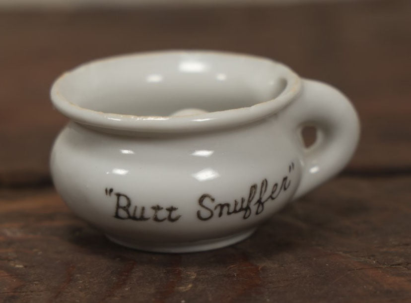 Lot 068 - Vintage Butt Snuffer Tea Cup Porcelain Novelty Ashtray, Made In Japan, With Upturned Butt In Cup