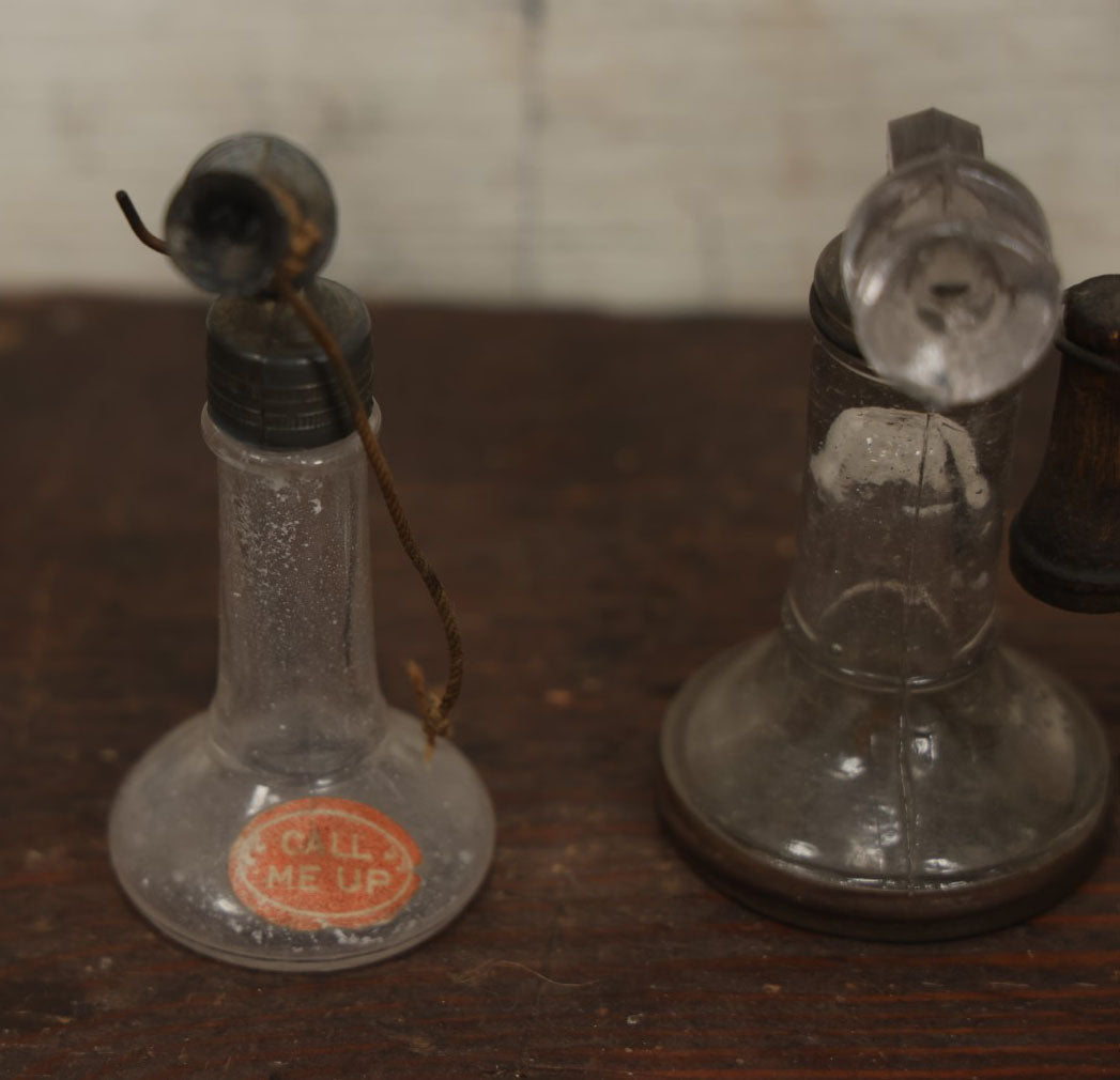 Lot 075 - Grouping Of Three Antique Stick Telephone Glass Candy Containers, Two With Wooden Phones, One With Original Candy Contents, By Victory Glass Company, Jeannette, Pennsylvania