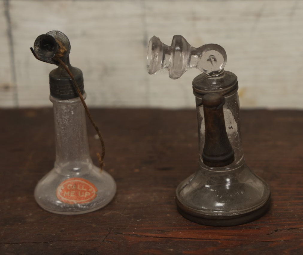 Lot 075 - Grouping Of Three Antique Stick Telephone Glass Candy Containers, Two With Wooden Phones, One With Original Candy Contents, By Victory Glass Company, Jeannette, Pennsylvania