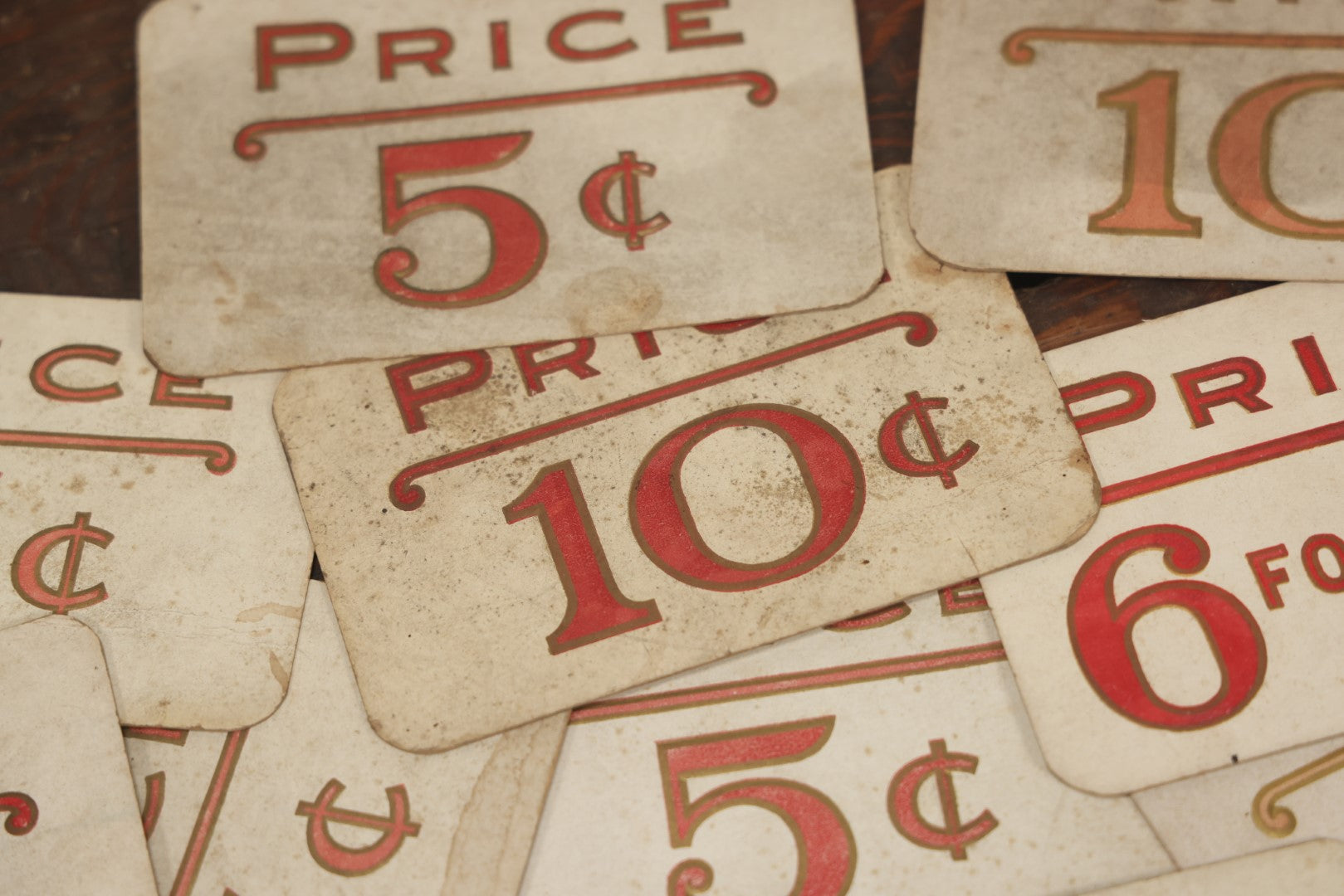 Lot 103 - Grouping Of 15 Medium Vintage Five And Dime Store Pricing Labels, 5C, 10C, And More, Embossed, Red Text, Approximately 3-1/2" x 5-1/2"