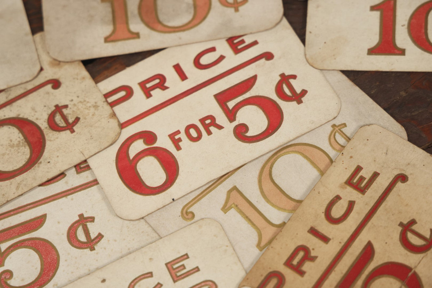 Lot 103 - Grouping Of 15 Medium Vintage Five And Dime Store Pricing Labels, 5C, 10C, And More, Embossed, Red Text, Approximately 3-1/2" x 5-1/2"