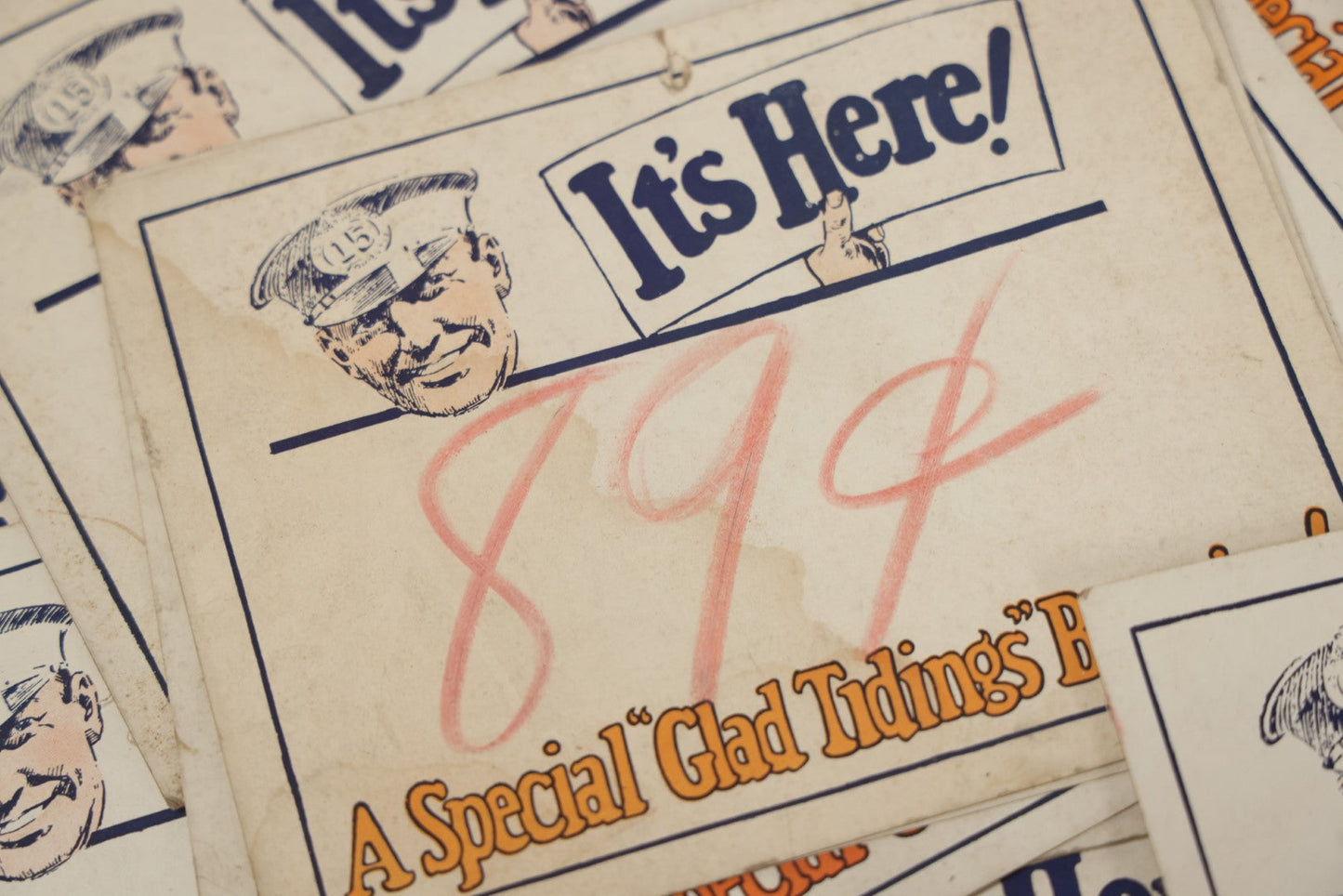 Lot 106 - Grouping Of 35 Larger Vintage Five And Dime Store Pricing Labels, "It's Here!", "A Special 'Glad Tidings' Bargain!" And More, With Man In Cap Mascot, Approximately 7" x 5-1/2"