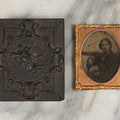 Lot 001 - Antique Union Case Thermoplastic Gutta Percha 1/9th Plate Hard Image Case With Angel And Baby, By S. Peck And Co., Manufacturers, With Damaged Ambrotype Of Woman