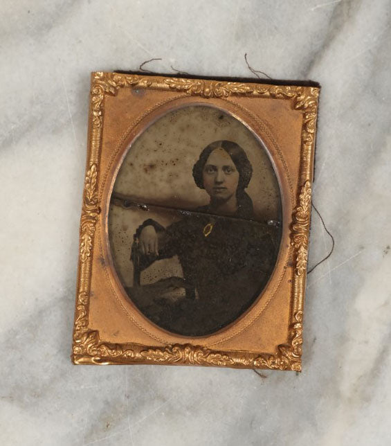 Lot 001 - Antique Union Case Thermoplastic Gutta Percha 1/9th Plate Hard Image Case With Angel And Baby, By S. Peck And Co., Manufacturers, With Damaged Ambrotype Of Woman