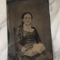 Lot 004 - Antique 1/2 Plate Tintype Photograph Of A Young Woman With An Open Book In Her Lap, Long Curls In Her Hair