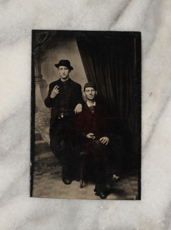 Lot 010 - Antique Tintype Photo Of Two Darkly Dressed Young Men In Hats Smoking Cigars