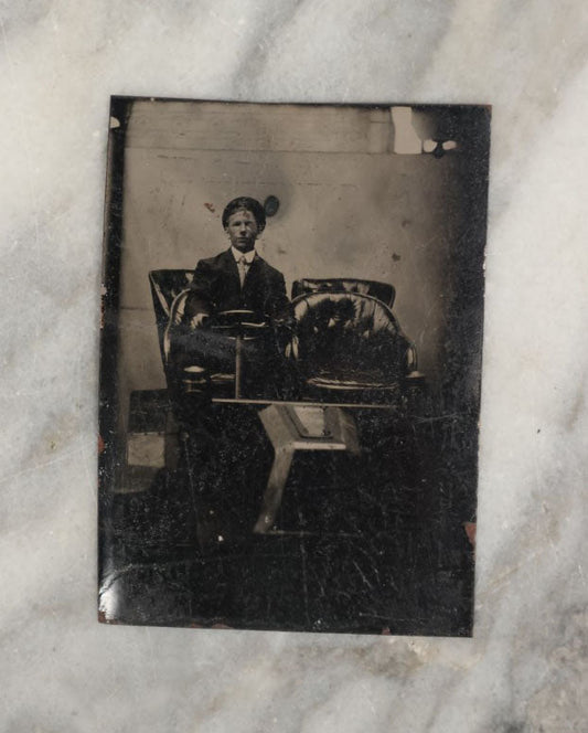 Lot 012 - Antique Tintype Photo Of A Man In An Early Automobile, Holding Steering Wheel, Tufted Leather Seats