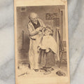 Lot 014 - Antique Carte De Visite C.D.V. Illustrated Album Filler Card, Hairdresser With Unwilling Boy, With Cat On Floor