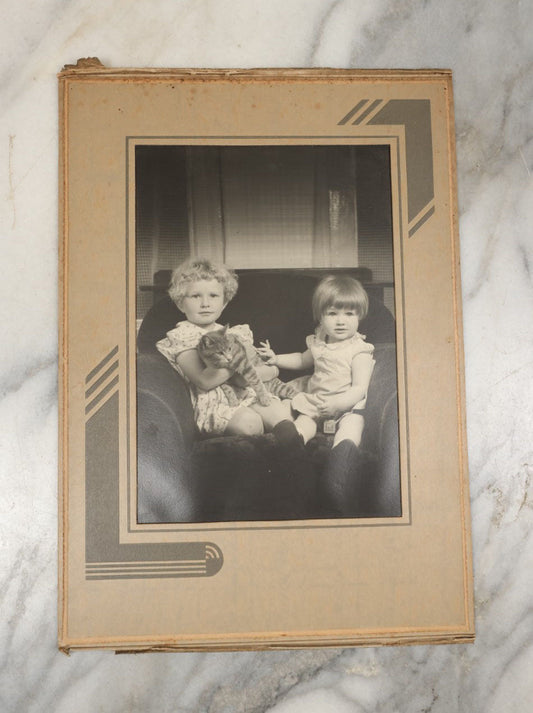 Lot 016 - Vintage Foldered Portrait Photograph Of Two Young Children Holding A Cat On A Sofa, Circa 1938, Robert H. Peters, Photographer, East Holliston, Massachusetts