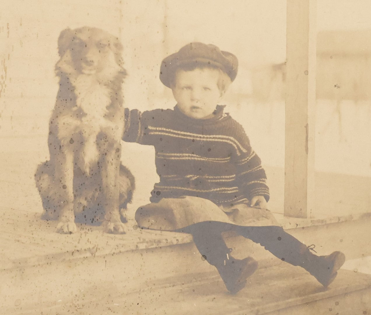 Lot 017 - Antique Boarded Photograph Of A Young Boy In A Hat Sitting On The Front Porch Stoop With His Dog, Identified As Floyd Clement, Jr.