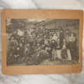 Lot 023 - Antique Boarded Occupational Photograph Of A Group Of Gruff Looking Laborers And Their Families, Likely On Thanksgiving, Note Men Displaying Turkey