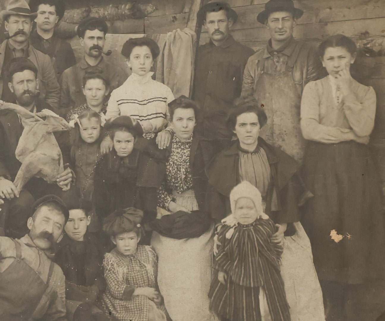 Lot 023 - Antique Boarded Occupational Photograph Of A Group Of Gruff Looking Laborers And Their Families, Likely On Thanksgiving, Note Men Displaying Turkey